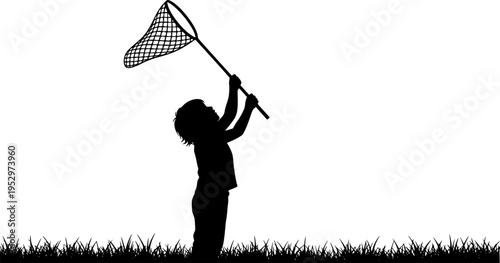 A silhouette of a child standing in a grassy field, holding a butterfly net raised high above their head, as if ready to catch something
