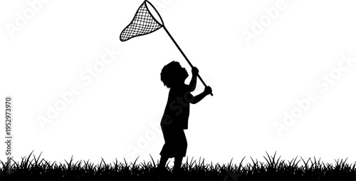A silhouette of a child standing in a grassy field, holding a butterfly net raised high above their head, as if ready to catch something
