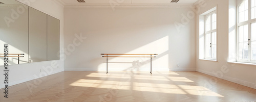 Bright and spacious dance studio with wooden ballet bar and large windows letting in natural light. Dance studio features reflective mirrors and warm wooden flooring,