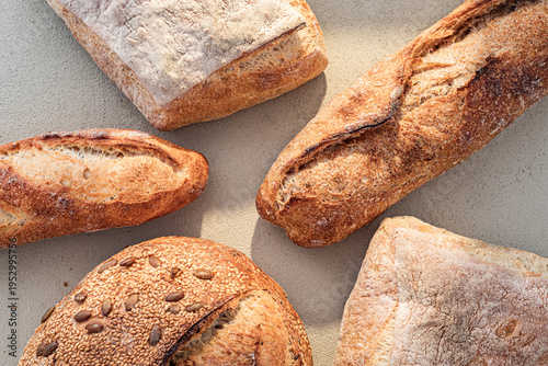 Bild auf Leinwand Assorted Artisan Bread on Rustic Concrete Background
