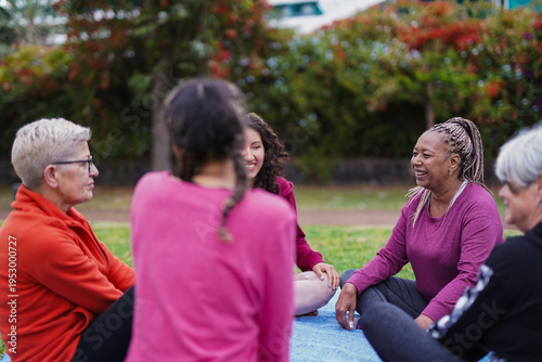 Group of multi generational women having fun together at city park - Multiracial people with different body, community and female circle concept
