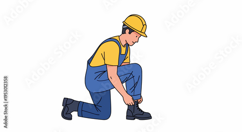 A worker in overalls and a yellow hard hat is tying his shoe.