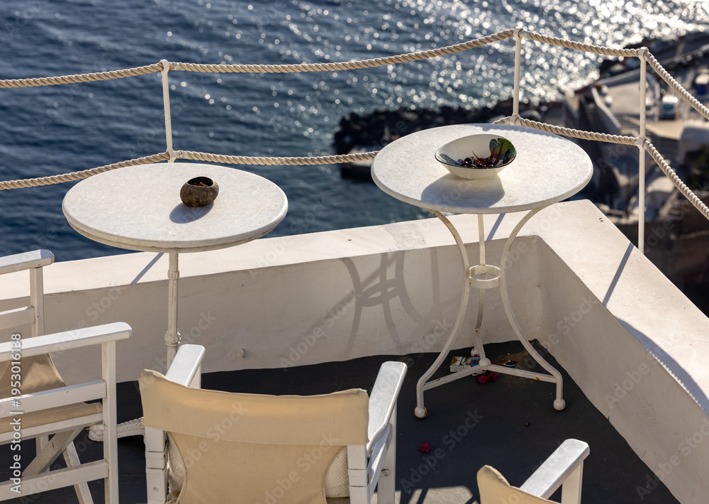 Naklejka premium Terrace in Oia with amazing view of sunset over caldera in Santorini Island. Greece