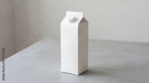 White carton sits on a gray table in a simple indoor setting during daylight hours