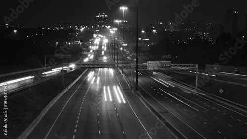 Highway 401 in Toronto from Don Mills overpass. Night time lapse. Black & white. HD video. 