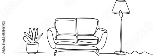 Cozy corner featuring a sofa with a floor lamp and potted plant