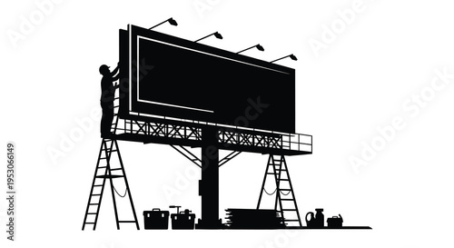 Silhouette of a man on a billboard with ladders and lights