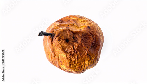 Brown decaying pear with soft wrinkled skin isolated on white