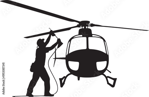 Black silhouette of man refueling helicopter