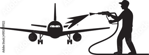 Man in silhouette painting airplane with spray gun