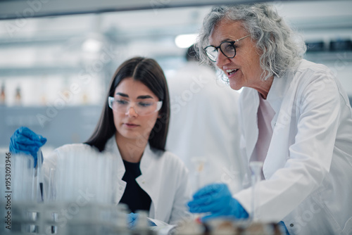 Fotografie Women scientists working on research experiment in laboratory