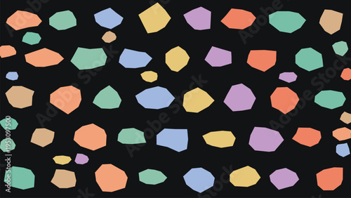 Abstract vector background with scattered irregular pastel colored geometric shapes on a dark black surface, creating a modern, playful, and versatile design element for digital and print media