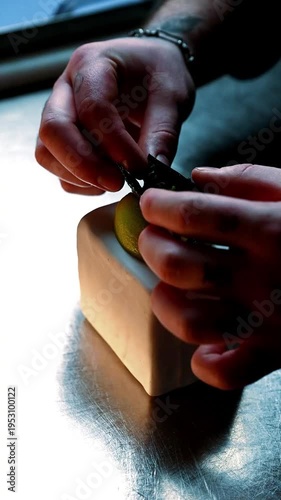 Sophisticated seafood plate arranged with lime and flavorful sauces on sleek ceramic surface