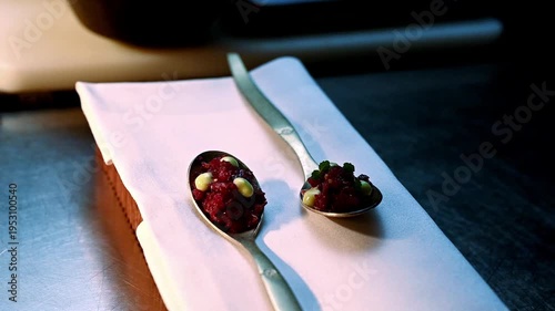 Pastry chef meticulously arranges glossy berries and pistachios for exquisite dining experience
