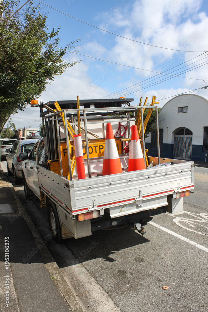 Fototapeta premium Pickup truck or ute with roadworks supplies in the back