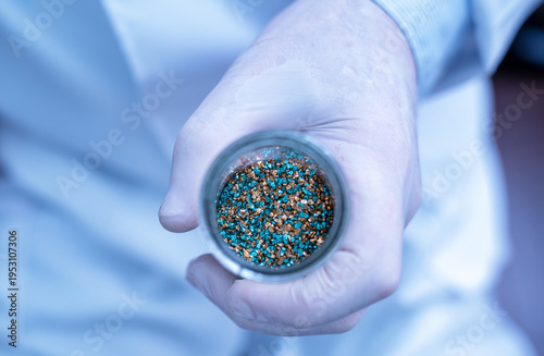 Tableau sur toile Chemist holding essential critical minerals for modern innovation and future tec
