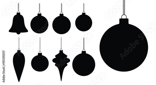 Collection of festive holiday ornaments in silhouette style hanging from strings.