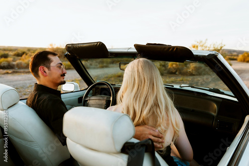 young couple in classic car