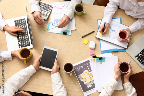 Hands of business people wi...