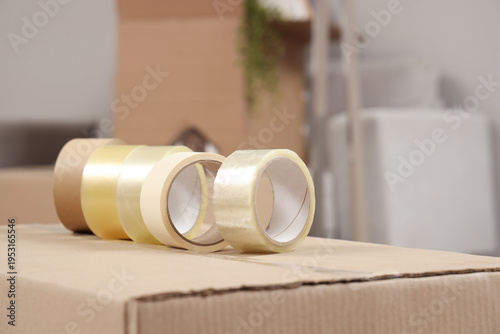 Cardboard box with adhesive...