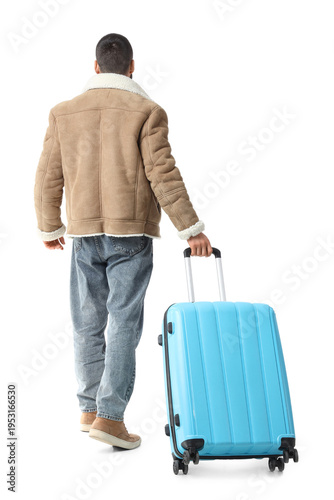 Male tourist with suitcase ...