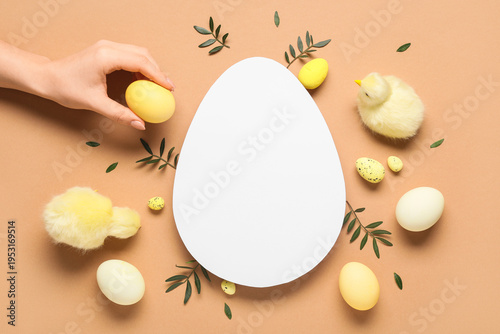 Female hand with egg-shaped...