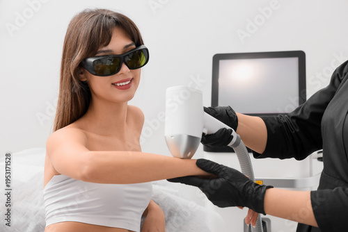 Female cosmetologist perfor...