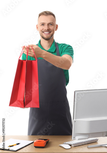 Male cashier with shopping ...