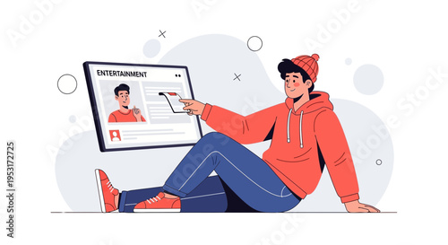 Young man in hoodie and beanie watching entertainment news on tablet, sitting on floor