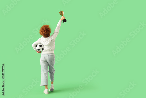 Female soccer fan with ball...