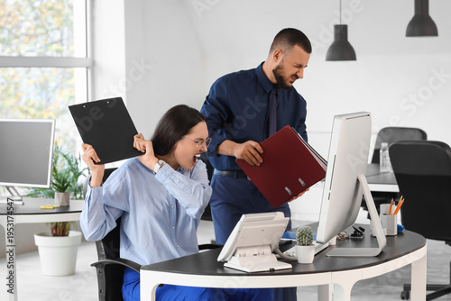 Male worker with folders an...