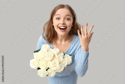 Happy young woman with enga...