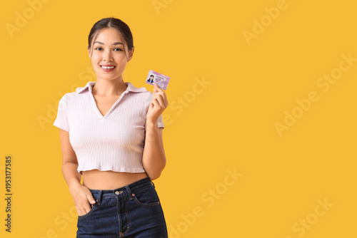 Young Asian woman with driv...