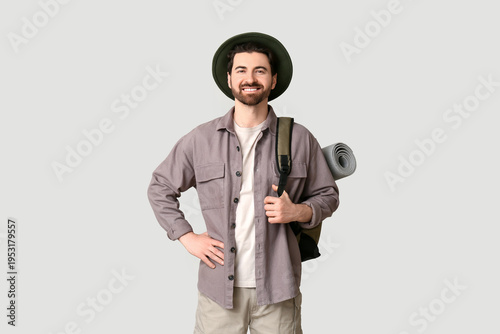 Young male tourist with bac...