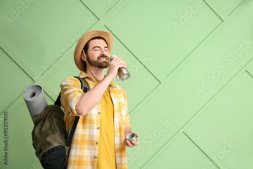 Young male tourist with bac...
