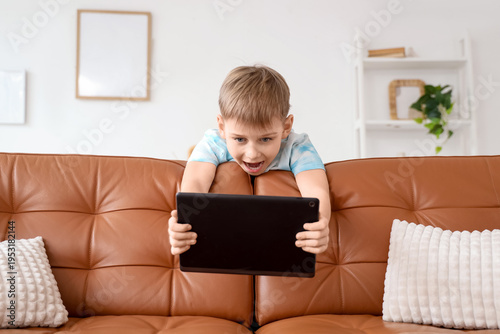 Surprised little boy with m...