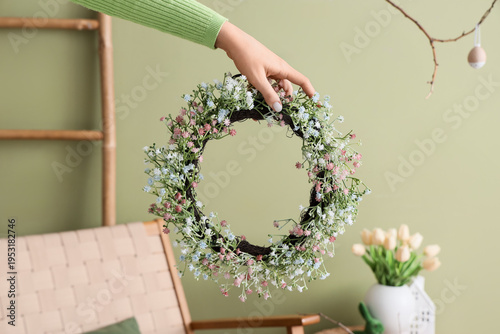Female hand with Easter wre...