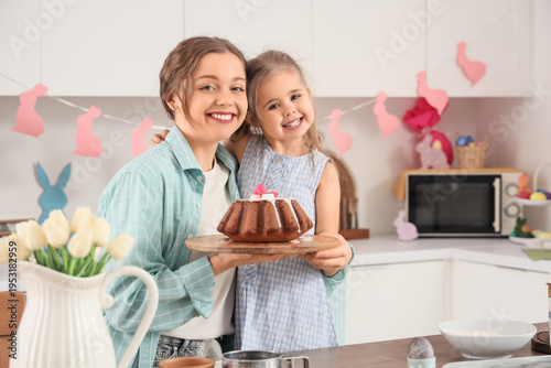 Happy mother and her cute d...