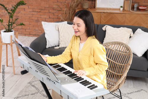 Happy young woman playing s...
