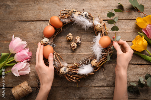 Woman making Easter wreath ...