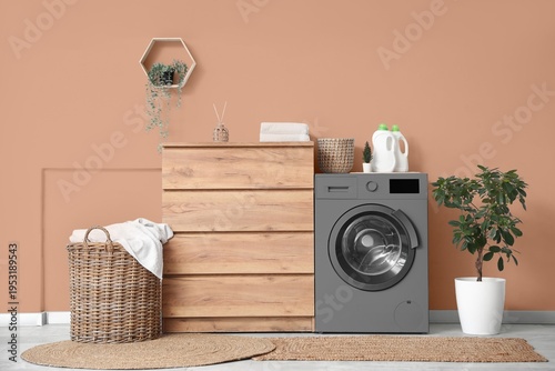 Stylish laundry room with m...
