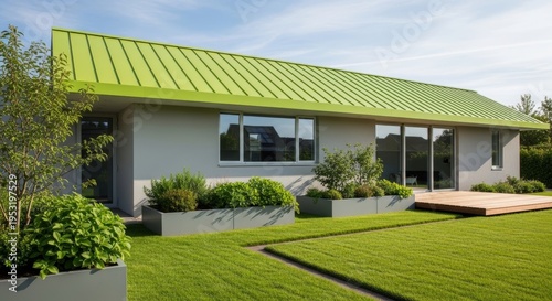 Modern One Story House With Green Metal Roof and Lush Garden on Sunny Day