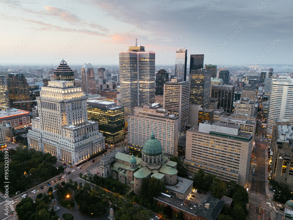 Fototapeta premium Aerial skyline of Montreal with Mary Queen of the World Cathedral and downtown skyscrapers at sunset, Quebec, Canada. g.
