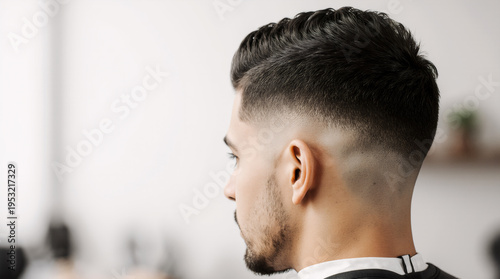 Taper low fade haircut back view clean modern barber hairstyle look