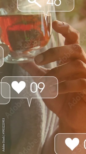 Hands holding double-wall cup entering, adjusting while social icons popping, visualizing rise