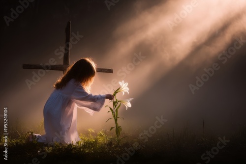A child in a white robe places a white lily at the foot of a wooden cross in ...