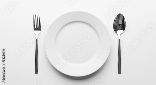 Empty White Plate with Fork and Spoon on White Background - Top View
