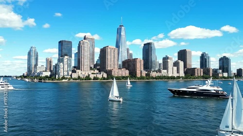 Sailing boats in city harbor waters.