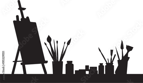 Black silhouette of easel with paintbrushes and bottles on table