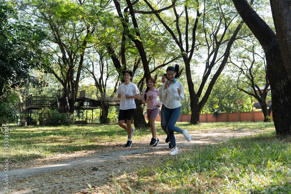 Obraz premium Group of Asian people jogging at public park